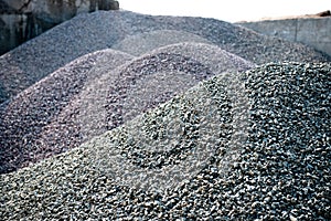 Gravel gray stone textures asphalt mix concrete in road construction. Pile rock and stone for Industrial photo