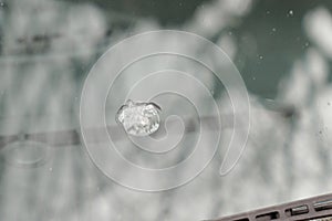 Gravel impact on car windshield Smashed windscreen of vehicle cracked glass