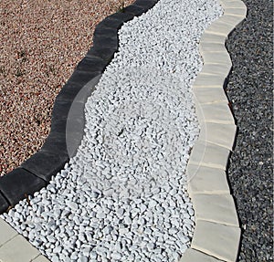 Gravel path with pavers and different mineral mulch