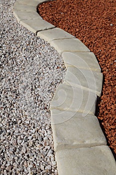 Gravel path with pavers and different mineral mulch