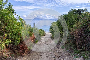 Gravel path to a secluded beach in Sithonia, Greece
