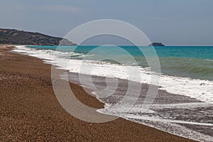 Gravel / pebble beach at the westcoast of Rhodes island near Kattavia with ocean waves