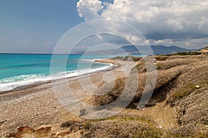 Gravel / pebble beach at the westcoast of Rhodes island near Kattavia with ocean waves