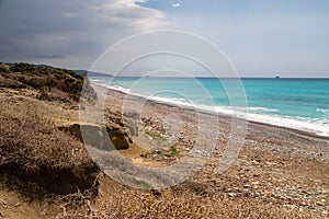 Gravel / pebble beach at the westcoast of Rhodes island near Kattavia with ocean waves