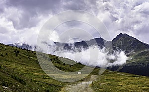 Gravel road through barren landscape in the Pyrenees Mountains, Spain photo