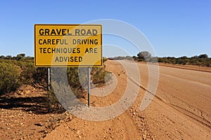 Gravel Road Careful Driving Sign