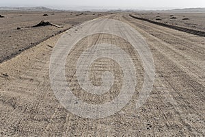 gravel road in desert at Moonlandscape, near Swakopmund, Namibia