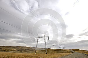 Gravel road with high voltage towers