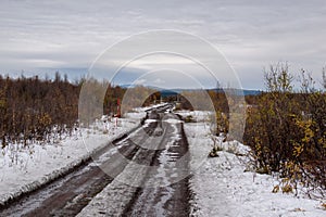 A gravel road in Kiruna, Swedish Lapland next to the Airport.