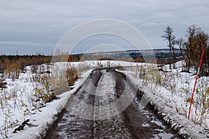 A gravel road in Kiruna, Swedish Lapland next to the Airport.