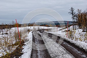 A gravel road in Kiruna, Swedish Lapland next to the Airport.