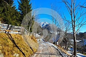 Gravel road at Srednji Vrh in Karavanke mountains