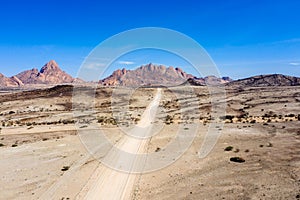 Gravel road to the mountains of spitzkoppe