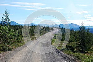 Gravel road at tundra mountains area Chukotka photo