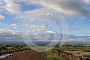 Gravel road with view on mount Kilimanjaro