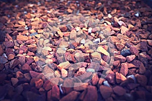 Gravel, rock and stone on ground closeup outdoor with detail on texture of environment or dirt road. Rocky, material and