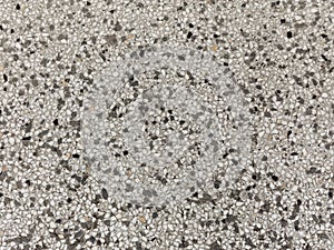 Gravel texture. Gravel background of black and white stones. Gravel grunge texture. Abstract pebble stone. Terrazzo floor.