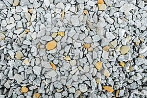 Gravel with white and yellow pebbles/texture background