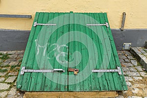 21-07-2021 Graven, Denmark. Here old weathered wooden bulkhead cellar doors with large black hinges