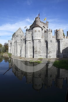 Gravensteen castle in Gand reflects in the water. photo