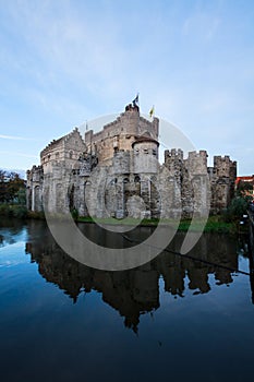 Gravensteen castle over pond, Ghent