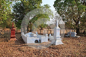 graves in a field at khone island (laos)