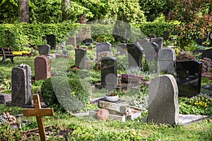 Graves with gravestones in a cemetery