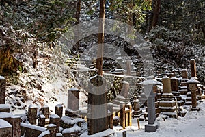 Graves under the snow in Okunoin Cemetery, Koyasan in the mount Koya region, UNESCO World Heritage, Wakayama prefecture, Japan