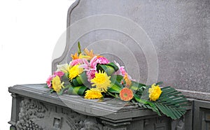 Gravestone and flower