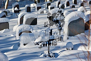 Graveyard with deep snow in winter