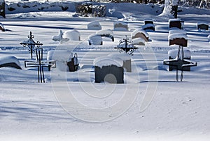 Graveyard with deep snow in winter