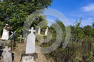 Funeral crosses in the old Corcova graveyard  photo
