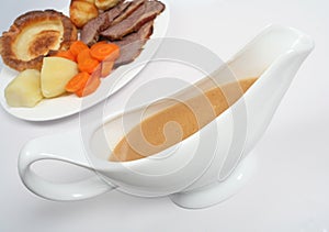 Gravy boat with dinner photo