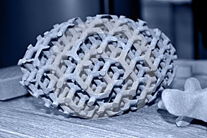 Gray abstract model object printed on 3d printer from powder close-up