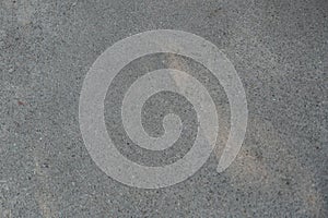 Gray asphalt texture. Surface of gray asphalt path with sun light