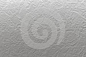 Gray background. Abstract texture of vinyl wallpaper on the wall