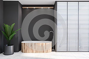 Gray bathroom with blinds and wooden tub