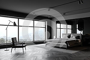 Gray bedroom and bathroom corner with armchair