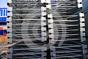 Gray big metal mobile shelving stacked in a warehouse of a construction shopping center. Shelves for placement and storage