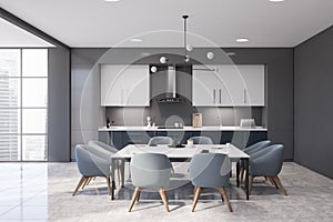 Gray and blue kitchen interior with table