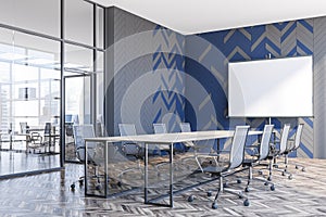 Gray and blue meeting room corner with screen