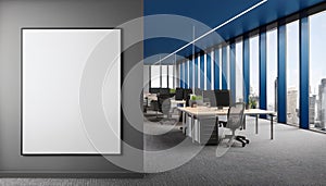 Gray and blue open space office with poster