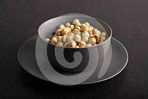 Gray Bowl with  hazelnuts photo