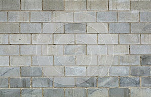 Gray brick concrete wall background. Texture of concrete bricks or blocks for construction. Stone and industrial patterns