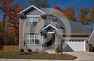 Gray Brick Contemporary Home with Side Wooden Fence