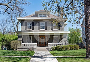 Gray Brick Craftsman Style House with Open Porch