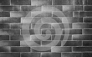 Gray brick gradient wall. Grunge background