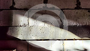 Gray Brick Wall With Light Beam And Shadow Texture. Abstract background, texture, pattern, frame, place for text, copy