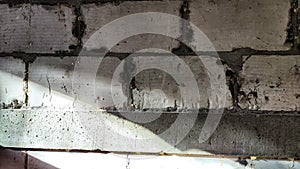 Gray Brick Wall With Light Beam And Shadow Texture. Abstract background, texture, pattern, frame, place for text, copy