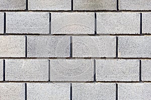 Gray bricks, wall made of large gray blocks. Gray background